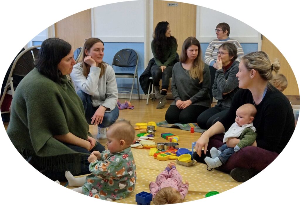 My Birth Support Events: Parents sitting on the floor with their little ones chatting at one of our My Birth Support events